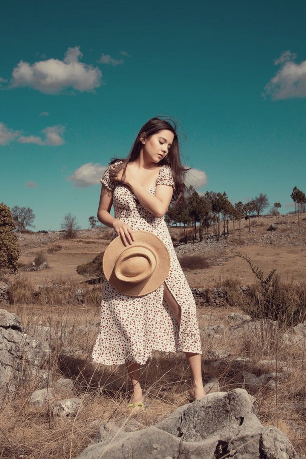 Woman wearing the Marisol printed cotton prairie midi dress